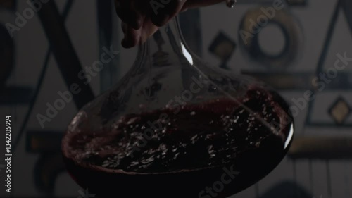 Red wine in the glass Decanter, close-up, selective focus. Slow motion 