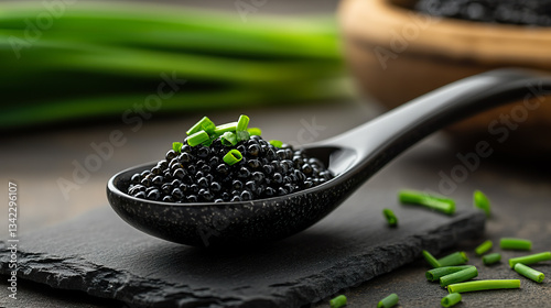Elegant Black Caviar on Glossy Spoon with Fresh Green Onion Garnish
