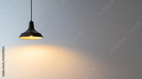 Illuminated Minimalist Interior: A Single Pendant Lamp Casts a Warm Glow