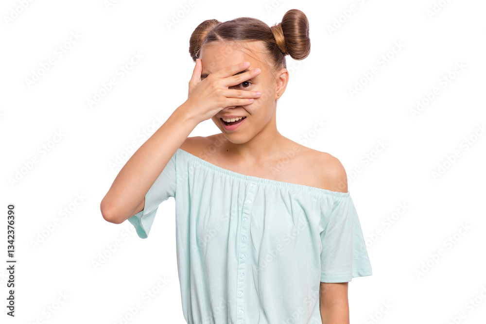 A young girl with playful hairstyle covering her face with one hand and smiling against a white background. A young girl with playful hairstyle covering her face with one hand and smiling against a white background.