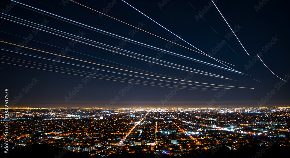 Obraz premium Dynamic motion meets urban beauty—a stunning capture of an aircraft’s light trails intertwined with the city’s sparkling night,landscape, aerodrome, night scene, city skyline