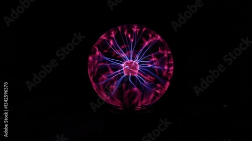 A Plasma Ball in the Middle of the Frame Against a Black Background