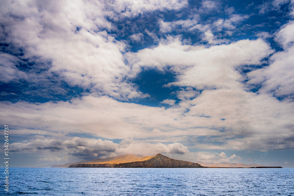 Striking dramatic skies hang over the coastal shores of the Channel Islands during a colorful Springtime day
