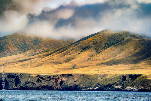 Striking dramatic skies hang over the coastal shores of the Channel Islands during a colorful Springtime day