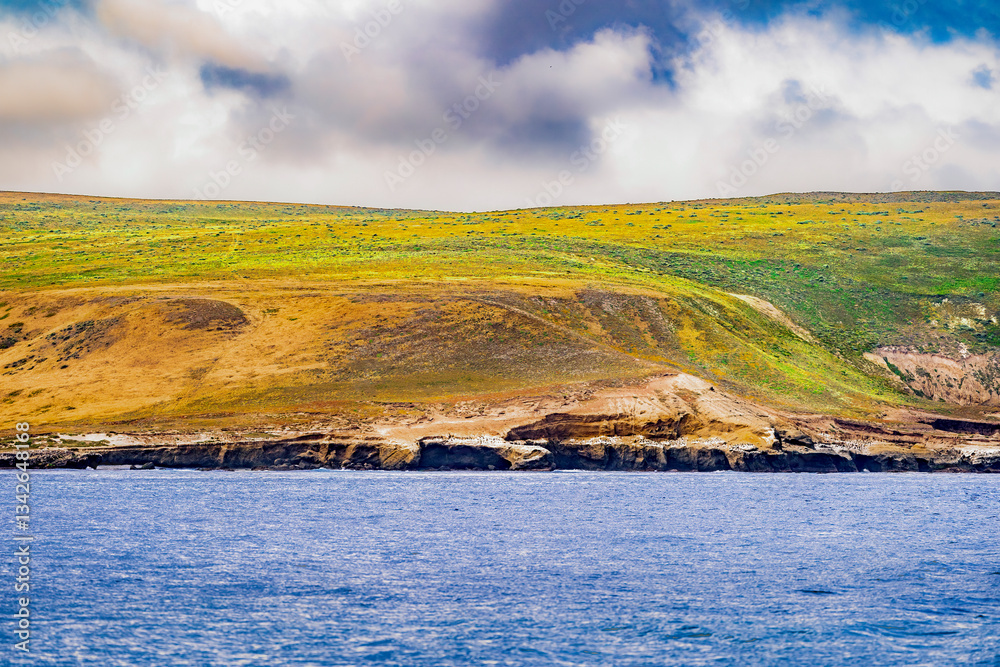 Striking dramatic skies hang over the coastal shores of the Channel Islands during a colorful Springtime day