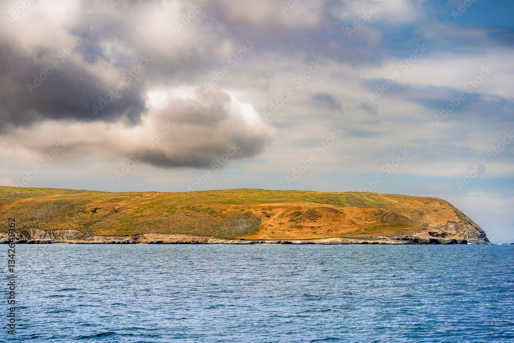 Striking dramatic skies hang over the coastal shores of the Channel Islands during a colorful Springtime day