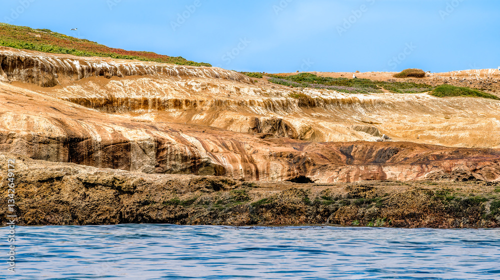 Striking dramatic skies hang over the coastal shores of the Channel Islands during a colorful Springtime day