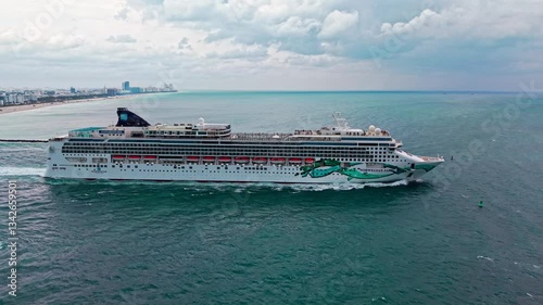 Miami, Florida, USA - March 12, 2025: Ship leaving Miami beach port. Norwegian Jade cruise ship voyage. Cruise in summer vacation. Norwegian cruise line. Cruise ship tour travel at sea. Travel memory