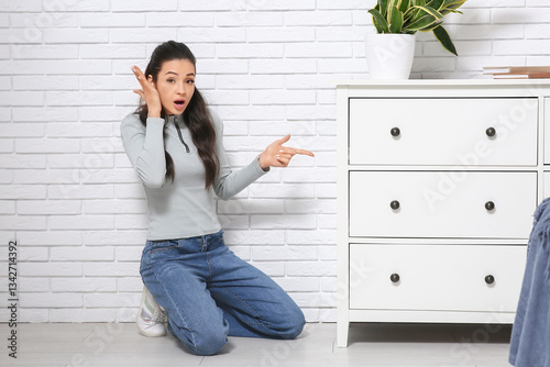 Surprised young woman found...