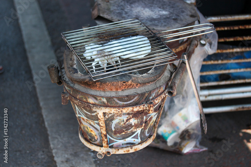 Grilled squid on a charcoal stove