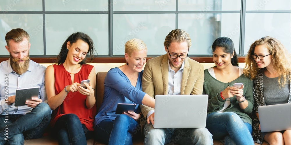 Group of diverse business people using devices. Business men and women with laptops and phones, technology devices. Group of diverse business team focus on laptop, casual people with digital devices Group of diverse business people using devices. Business men and women with laptops and phones, technology devices. Group of diverse business team focus on laptop, casual people with digital devices