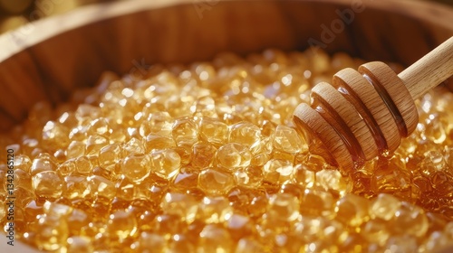 A glistening cascade of golden honey drops, adorned with a wooden honey dipper, inviting the viewer to partake in a sweet nectar.