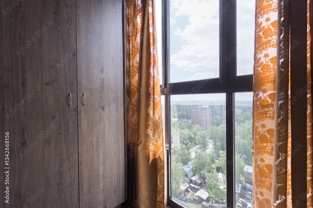 Fototapeta premium the balcony of an apartment on the upper floors of an apartment building
