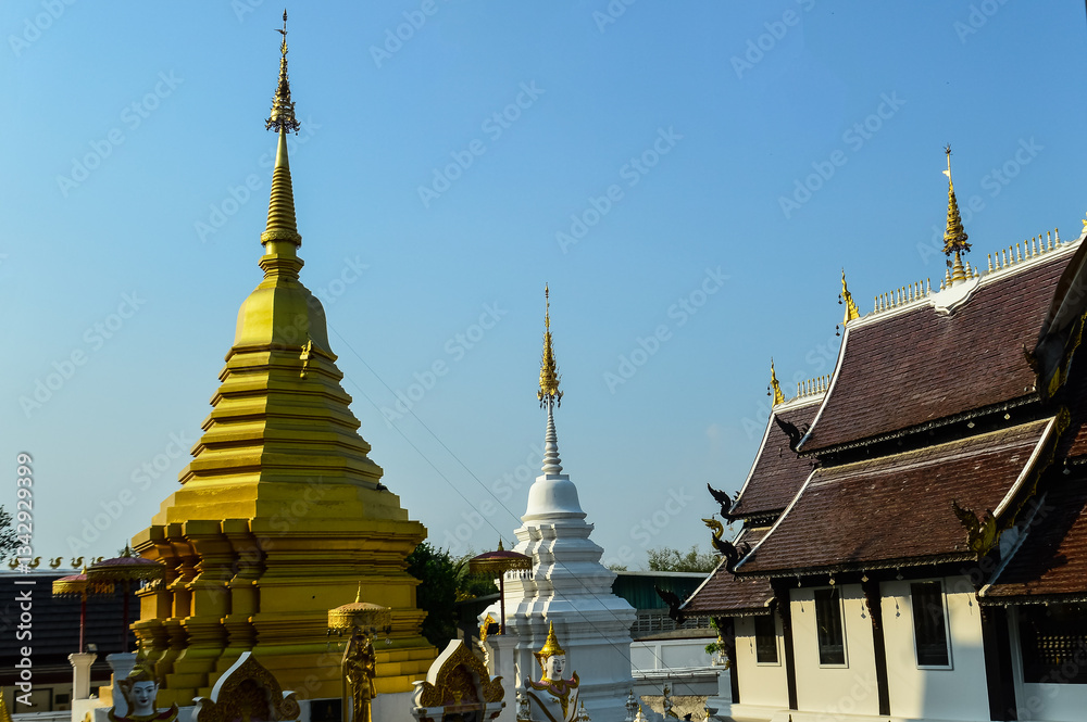 Fototapeta premium Pagoda and Chapel, Lanna Architecture, Symbols of Buddhism, South East Asia at San Pu Loei Saleewiangkaew Temple, Chiang Mai, Northern Thailand