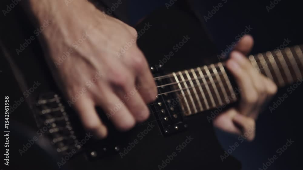 Musician playing electric guitar slow motion montage