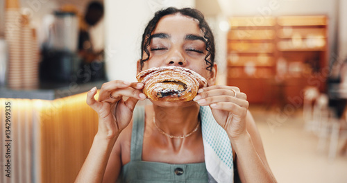 Cafe, happy and woman pastry eating for breakfast with snack, meal and hungry with craving. Coffee shop, restaurant and person with croissant, baked confectionery and bite delicious food for dessert photo