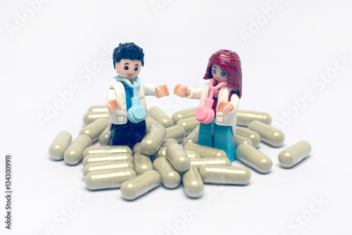 Doctor doll and capsule medicine photo