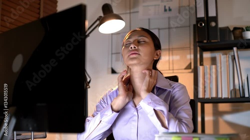 Businesswoman employee working overtime late night feeling tired and stress out with new business project problem on laptop in office