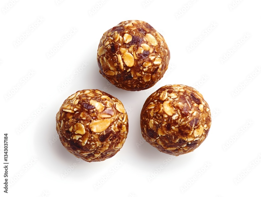 Three homemade energy balls made with oats nuts and dried fruit are shown against a white background. Three homemade energy balls made with oats nuts and dried fruit are shown against a white background.