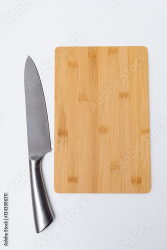 empty wooden cutting board and knife on kitchen table, top view