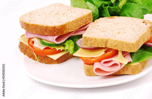Healthy ham sandwich with cheese, tomatoes on white background