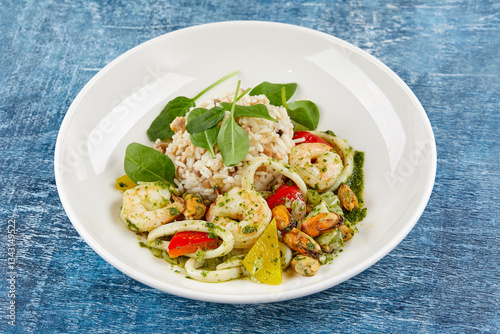 risotto with seafood on white plate