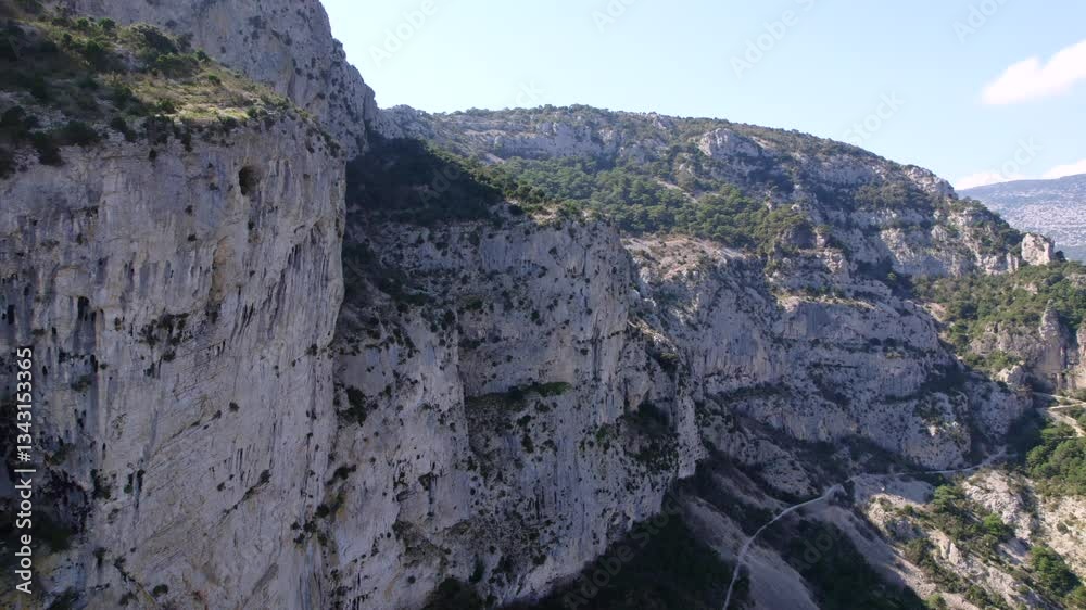Aerial view of Cirque de l'Infernet Hiking trail and mountains by Saint-Guilhem-le-Désert in Occitanie France Aerial view of Cirque de l'Infernet Hiking trail and mountains by Saint-Guilhem-le-Désert in Occitanie France