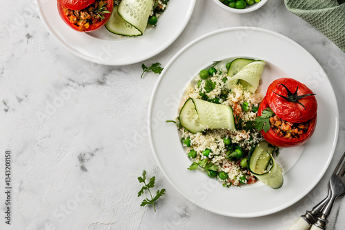 The concept of healthy eating. Turkey-stuffed tomatoes with whole wheat couscous salad