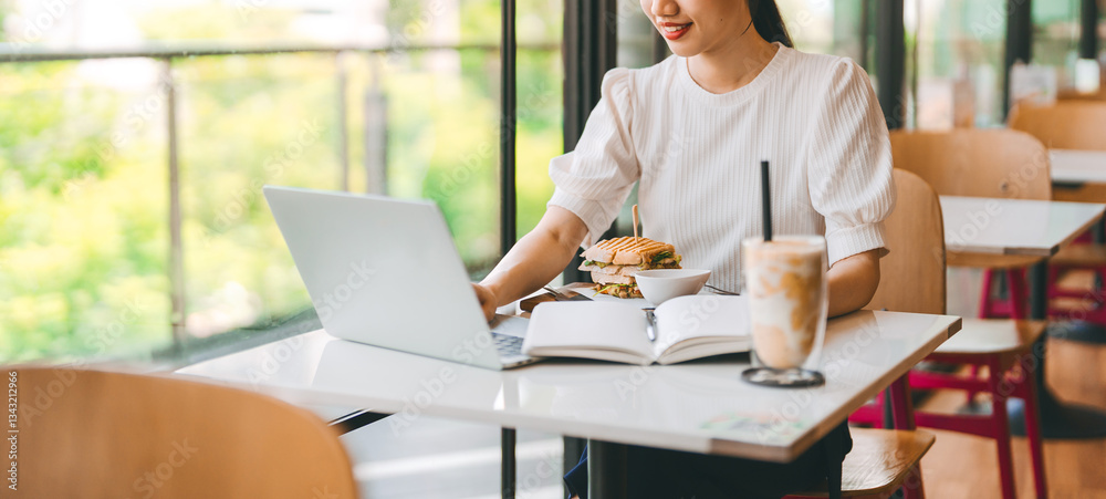 Fototapeta premium Adult business asian woman thinking for idea writing daily journal at indoors cafe