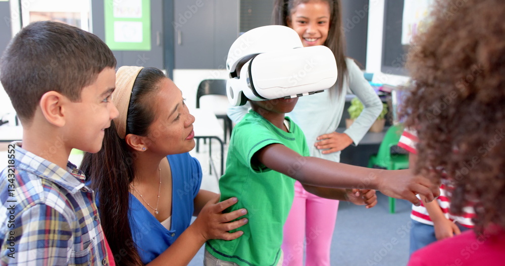 Obraz premium In school, children using VR headset with teacher guiding them in classroom
