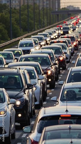 Busy urban traffic jam on highway during rush hour with endless car queues