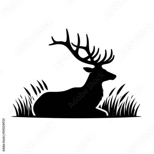 Deer with antlers lying in grass silhouette