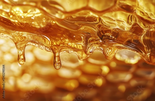 Close-up of golden honeycomb with viscous honey dripping. photo