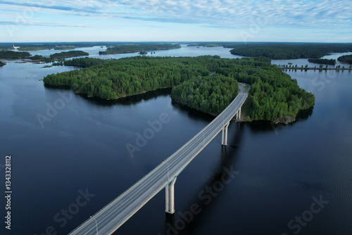 Canvas Print A scenic aerial view of Luukkaansalmi Bridge in Lappeenranta, Finland, crossing the blue waters of Lake Saimaa