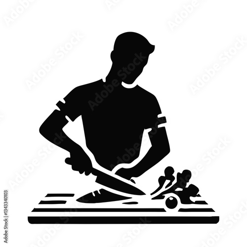 Young man cutting vegetables in a kitchen, cooking preparation concept