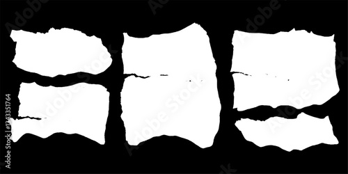 Torn papers scattered across a dark surface evoke feelings of nostalgia and lost thoughts in a creative artistic arrangement