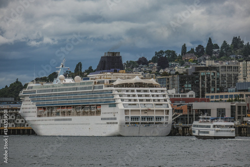 Obraz na płótnie Modern cruiseship cruise ship ocean liner Sun sail away departure from Seattle, Washington State for Alaska summer cruising on grey cloudy day with city skyline w salonie