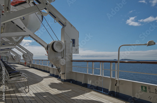 Obraz na płótnie Outdoor promenade boat deck patio terrace onboard classic expedition cruiseship cruise ship liner during cruise through Orkney Islands archipelago coast line w salonie