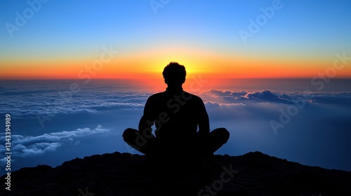 Serene Silhouette of a Person Meditating at Sunrise Over a Sea of Clouds in a Majestic Landscape