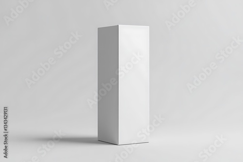 A pristine white box stands tall, a silent promise of untold contents against a minimalist backdrop of soft, neutral light.
