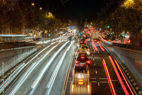 Long exposure of cars driving at night in madrid, spain