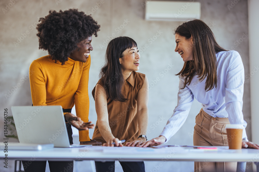 Diverse Team Collaborating Enthusiastically in a Modern Office Environment