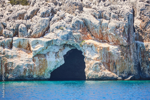 Fototapeta Naklejka Na Ścianę i Meble -  Asırlı Island, Turkey. The cave in the rock. The Mediterranean Sea