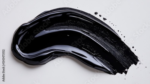 A sleek, glossy black gel sample, meticulously arranged on a pristine white background, exudes an aura of sophistication and allure.