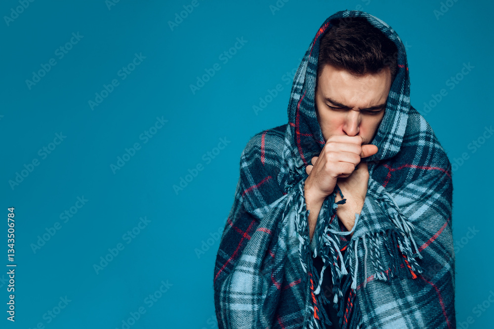 Fototapeta premium Young ailing guy with influenza virus coughs