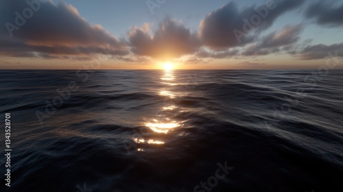 Obraz na płótnie Sunset over a vast ocean. Calm waters reflect the golden sun w salonie