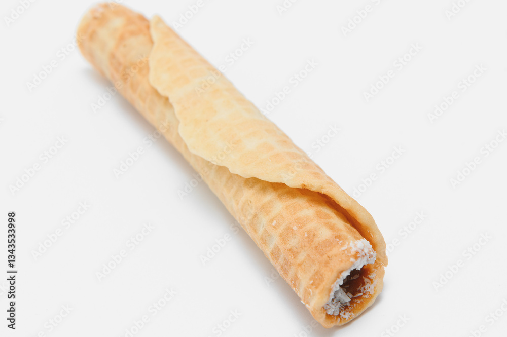 Delicious wafer rolls with boiled condensed milk isolated on white background
