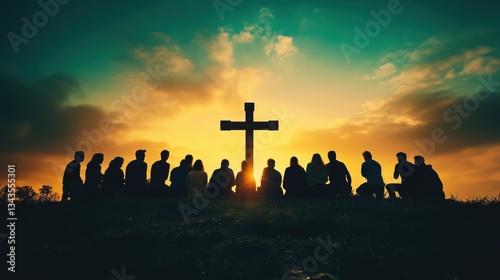 Diverse group of people praying together on a hilltop at sunrise with a christian cross silhouette