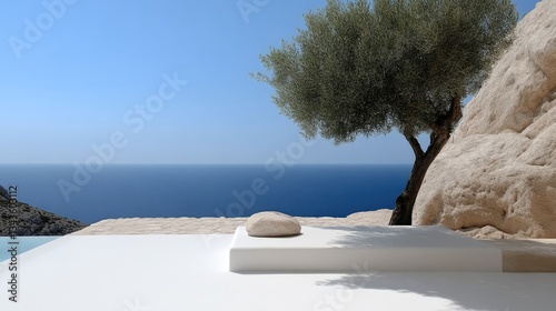 Obraz na płótnie Serene coastal terrace overlooking a vast azure sea, featuring a minimalist white platform and a large olive tree against a backdrop of rugged beige cliffs w salonie