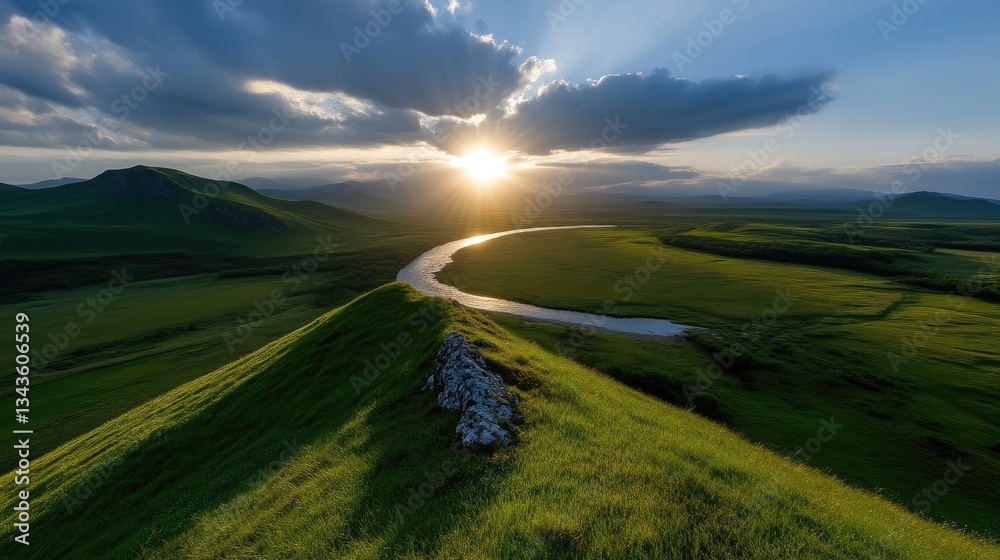 Sunset over a meandering river valley. Lush green hills and valley, illuminated by a golden sunset